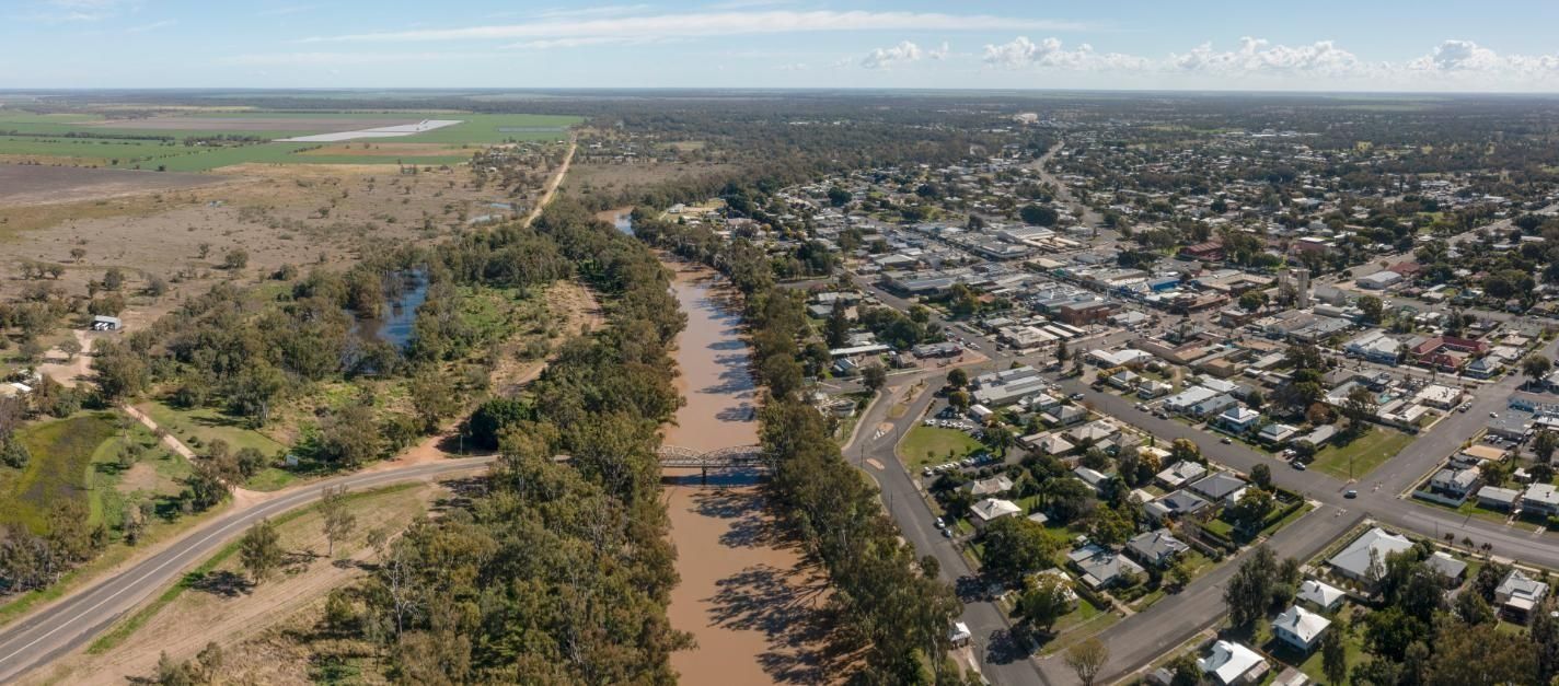 Aerial View of a River Cutting Through a Town With Homes — PowerMaster Batteries Moree in Goondiwindi, NSW