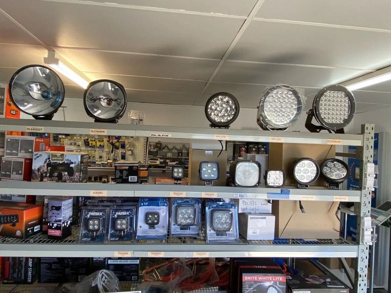 Store Shelf Displaying Round LED Lights and Boxed Lighting Fixtures — PowerMaster Batteries Moree in St, Moree, NSW