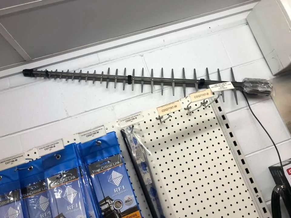Black Polearm Mounted High on a White Pegboard Wall — PowerMaster Batteries Moree in St, Moree, NSW