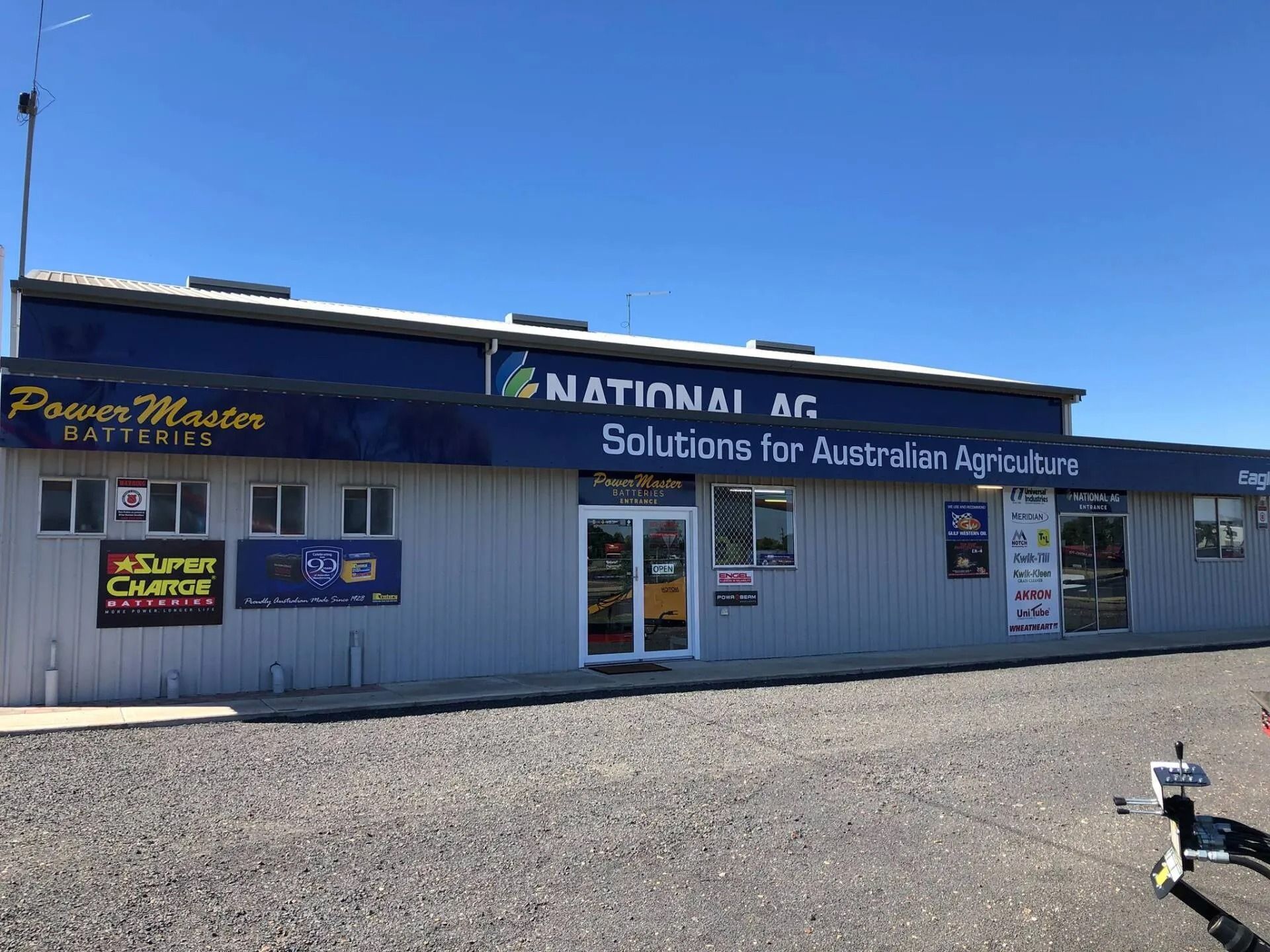 National AG Storefront With Blue Awning and Sign — PowerMaster Batteries Moree in St, Moree, NSW