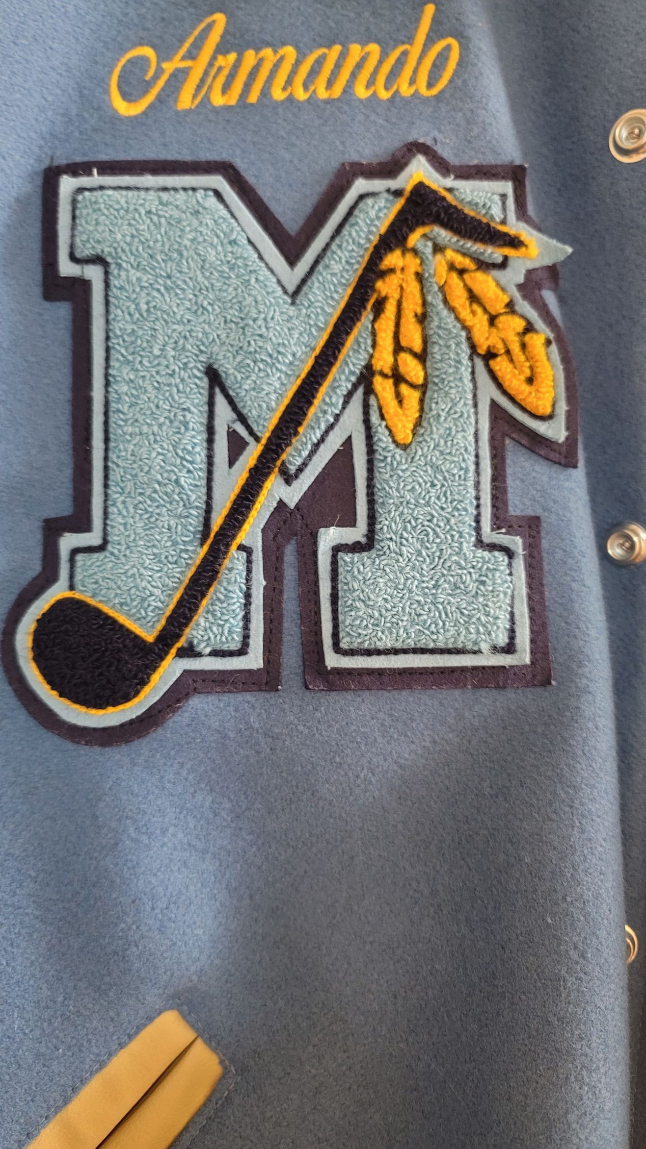 Charcoal honor society varsity jacket with gold crest embroidery