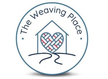 The Weaving Place logo: blue circle with a house outline and woven heart in red, blue, and white.