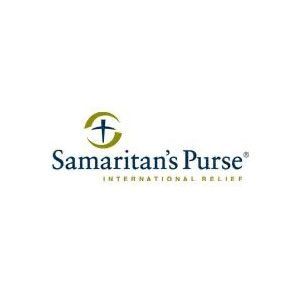 Samaritan’s Purse logo with blue text and a green-and-gold cross emblem on a white background
