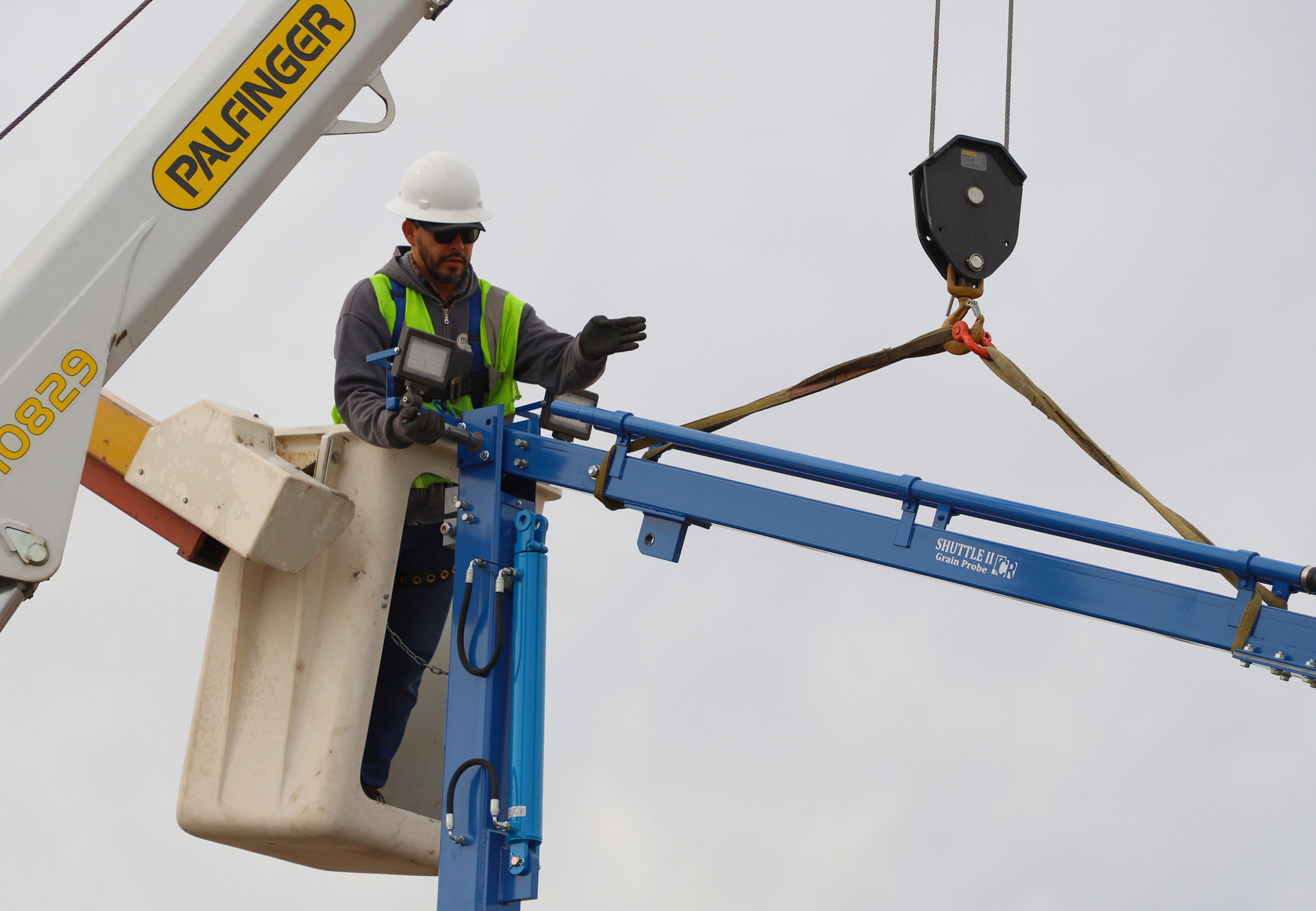 A man is working on a crane 