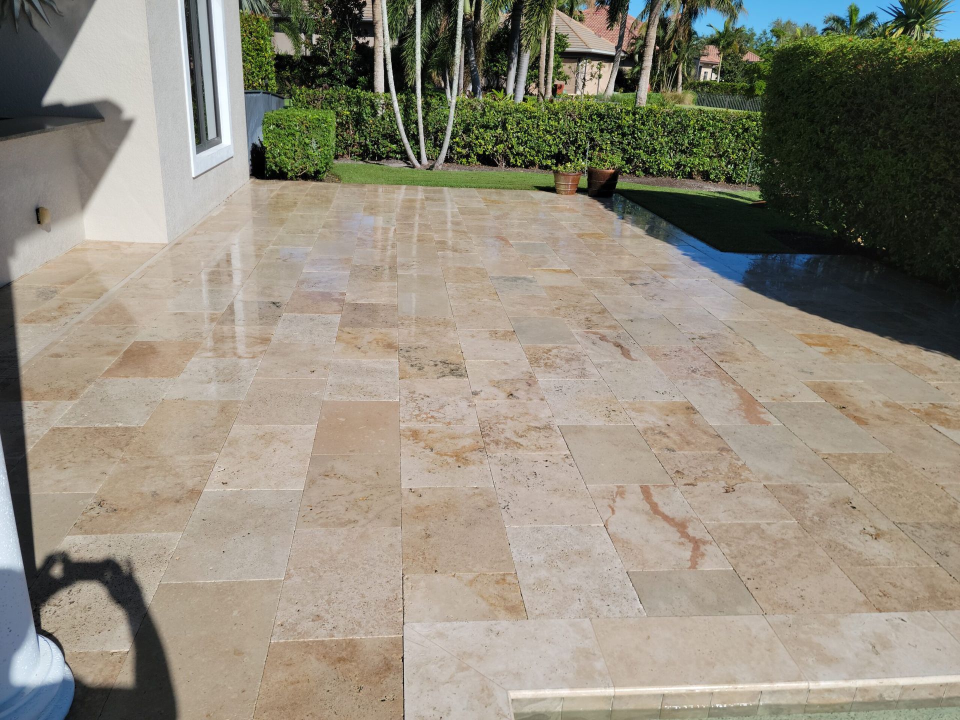 Beige tiled patio reflecting sunlight