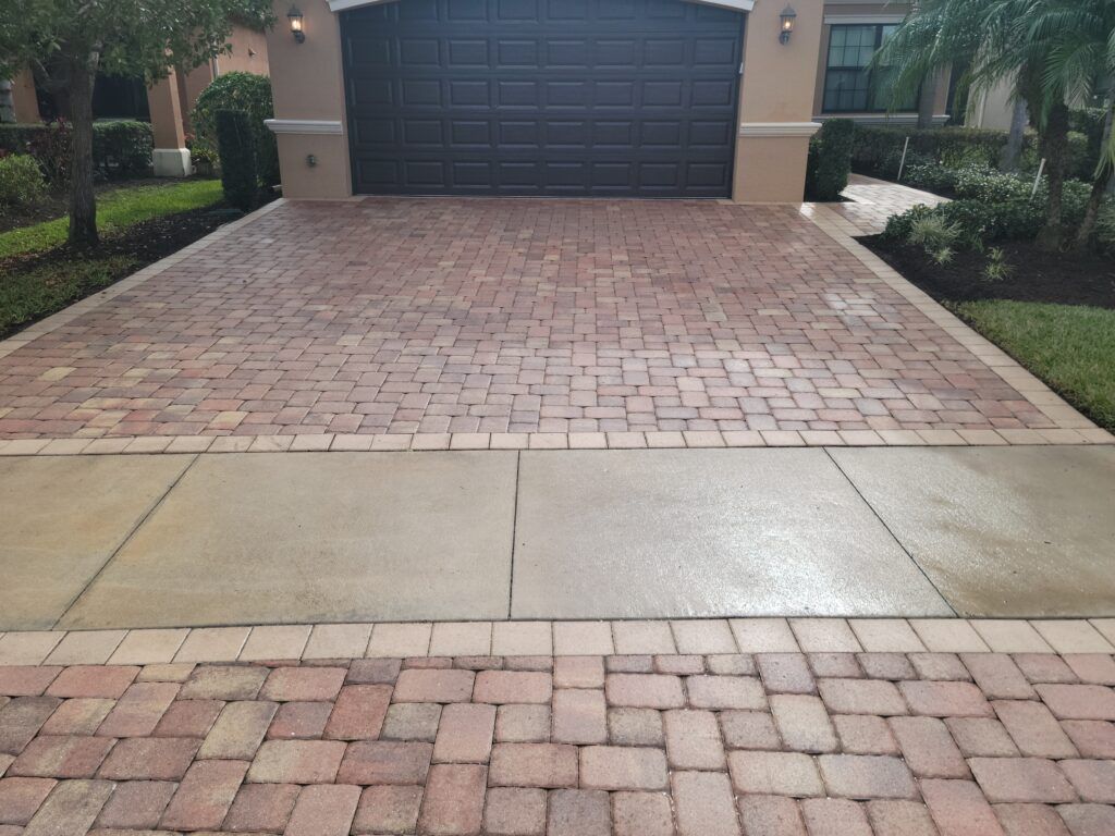 Brick driveway leading to a garage