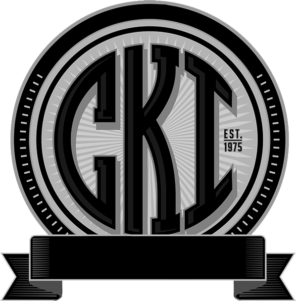 Black and white logo: GKC initials within circles, "EST. 1975", and a banner.
