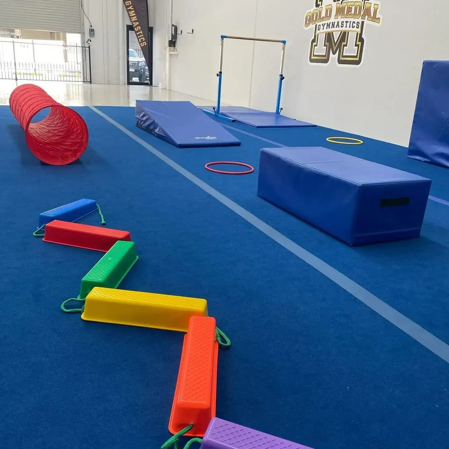 A Gym With A Sign That Says Gold Medal Gymnastics — Gold Medal Gymnastics In Molendinar, QLD