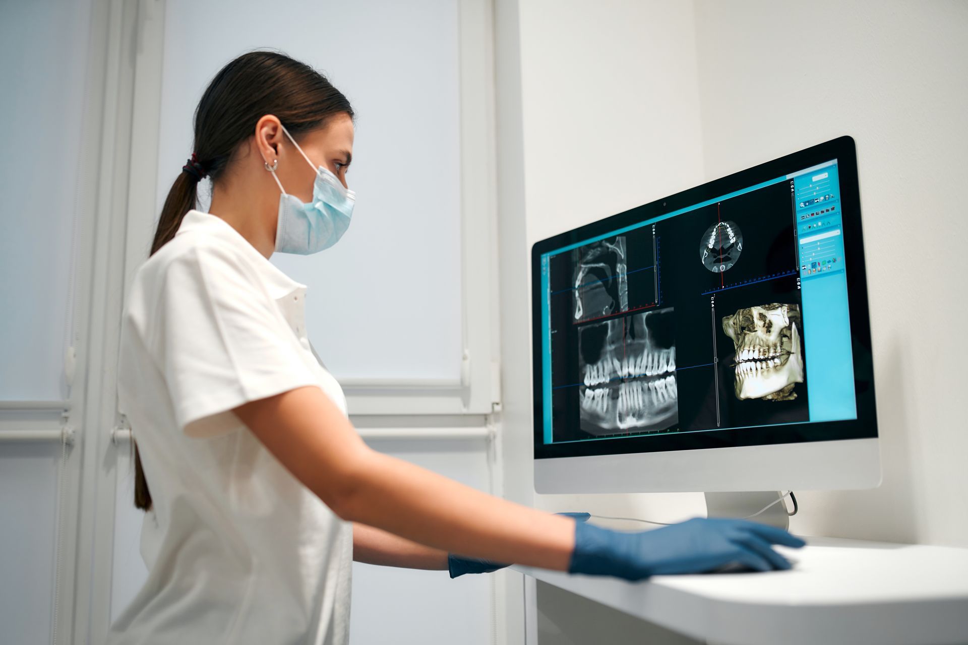 dental technician looking at dental xray