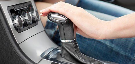 Hand on an automatic gear stick