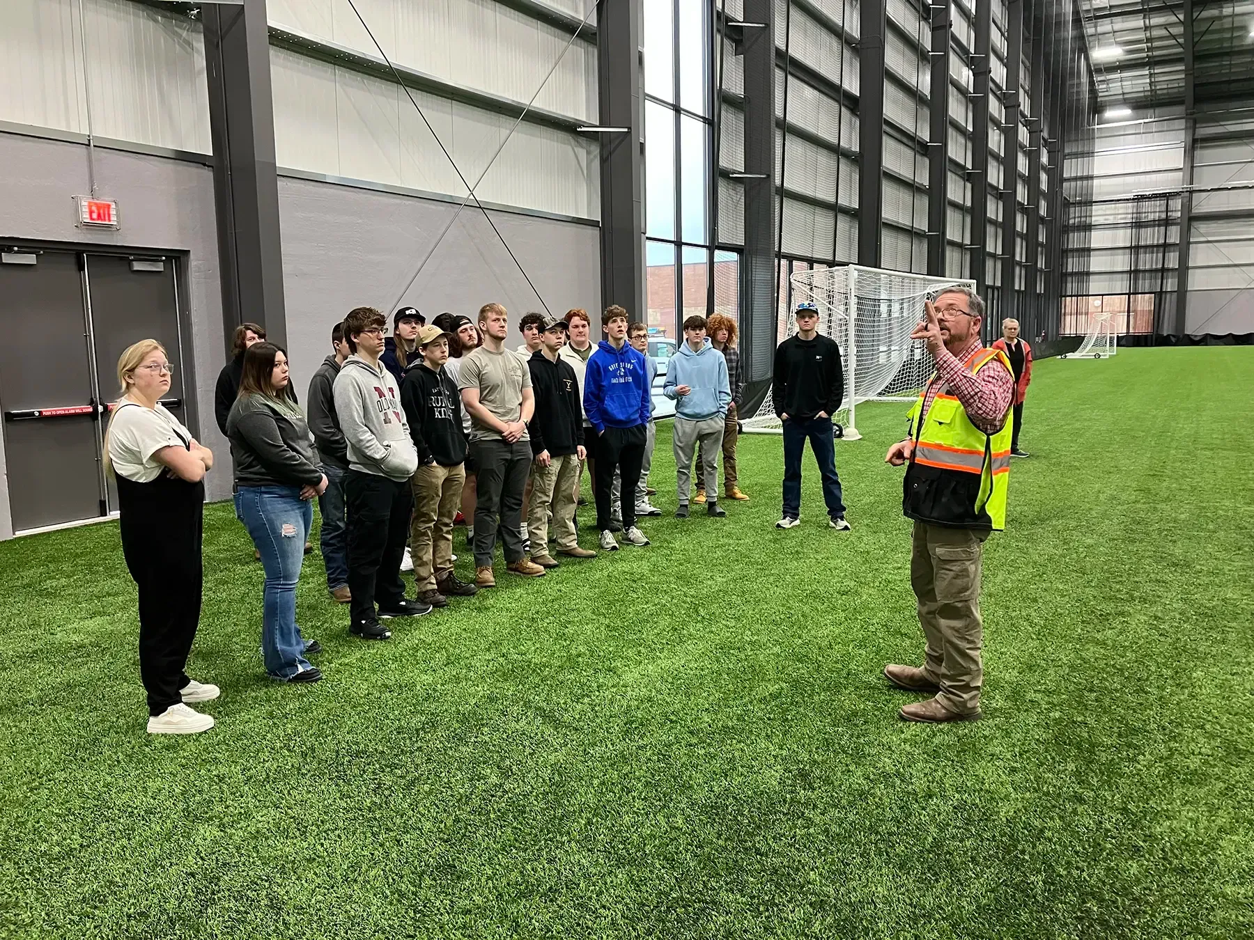Photo of Force Construction providing a tour of the Circle-K Fieldhouse to high school students