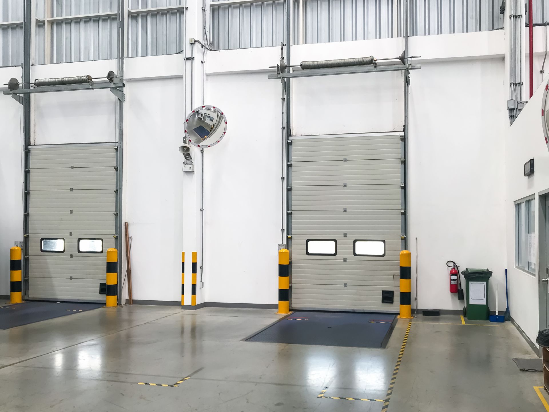 Two loading dock doors in a warehouse.