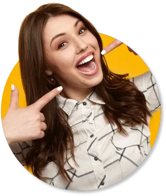 A woman is smiling and pointing at herself with her finger