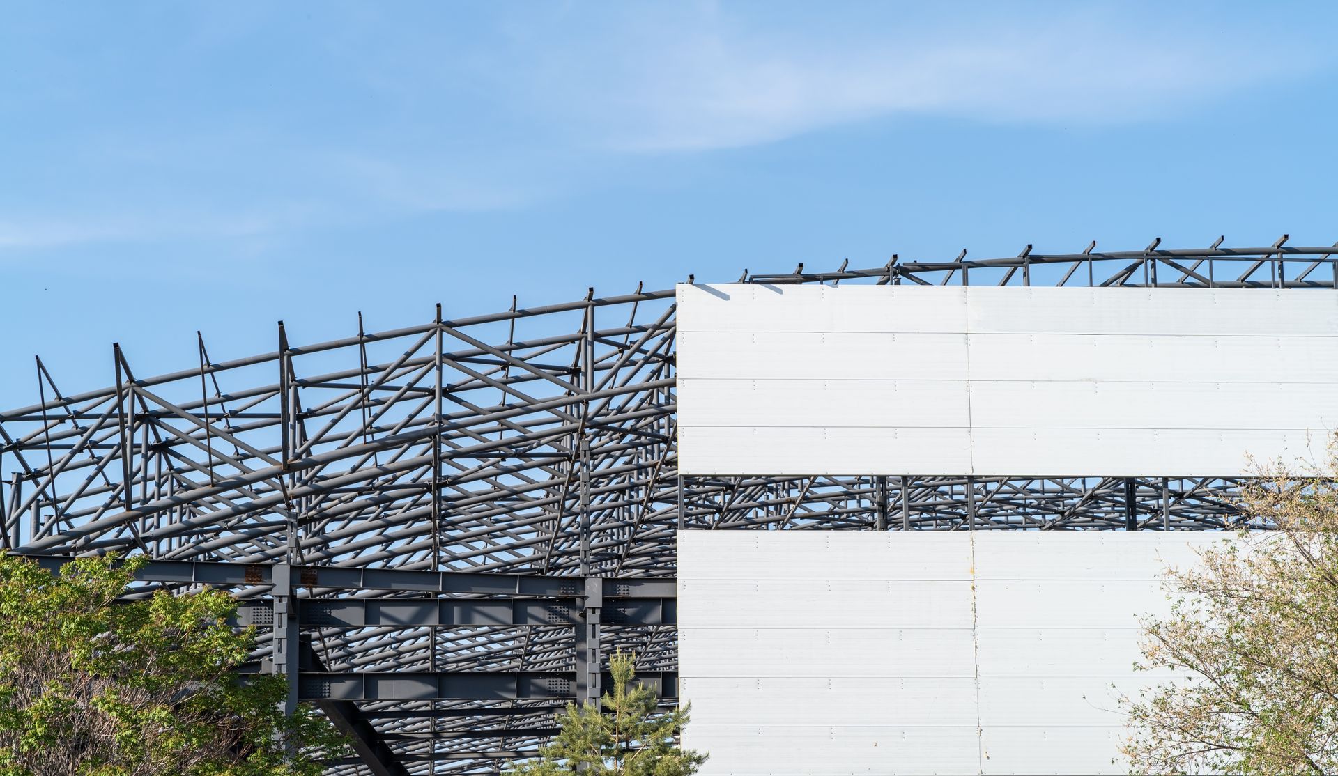 External insulated metal wall facade panels are installed on a steel structure.