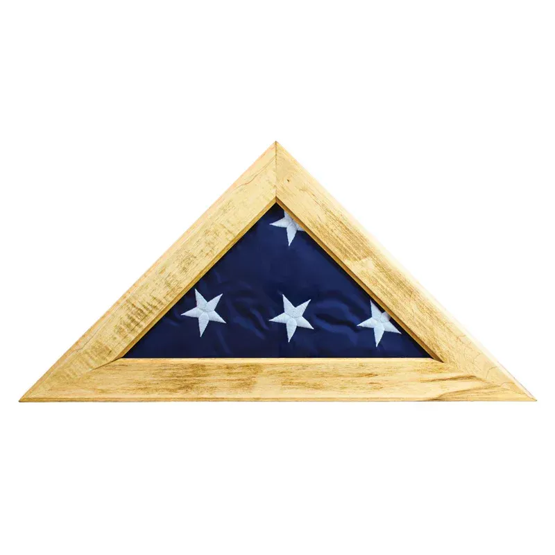 Folded American flag in a wooden triangular display case