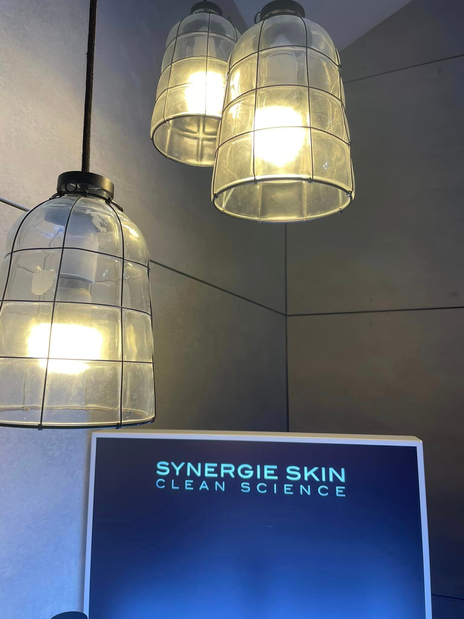 Three pendant lamps illuminating a display for