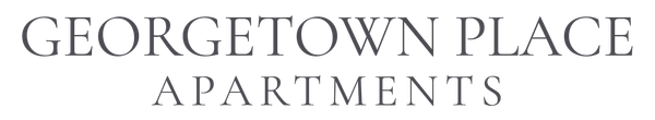 Mangrove Townhomes logo in dark blue text on a white background