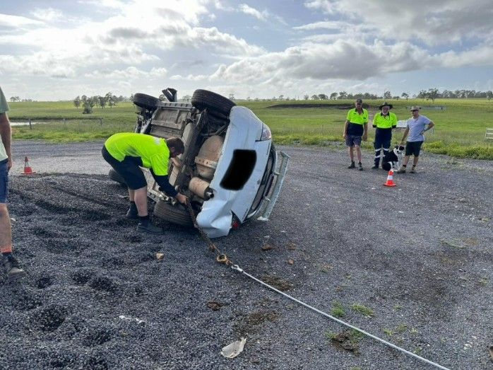 A Car is on Its Side on the Side of the Road — TNT Towing - Coffs Clarence in Lismore, NSW