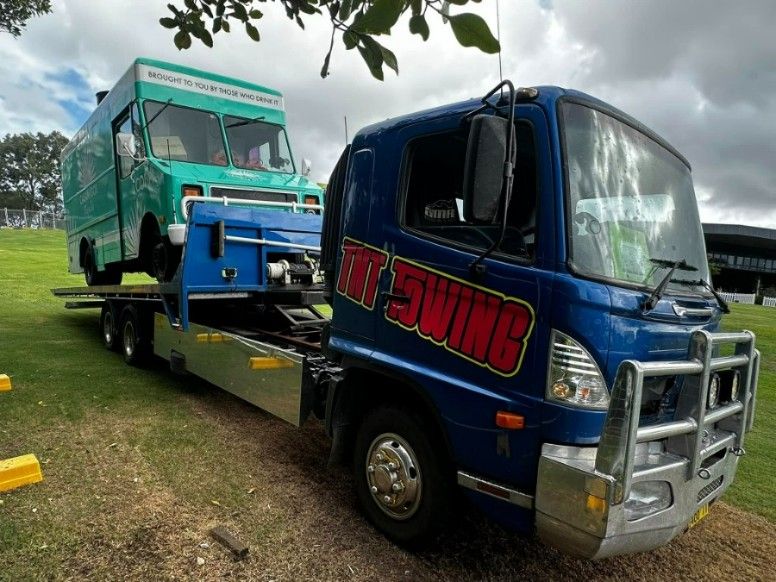 A Blue Tow Truck With the Word Swing on It — TNT Towing - Coffs Clarence in Iluka, NSW