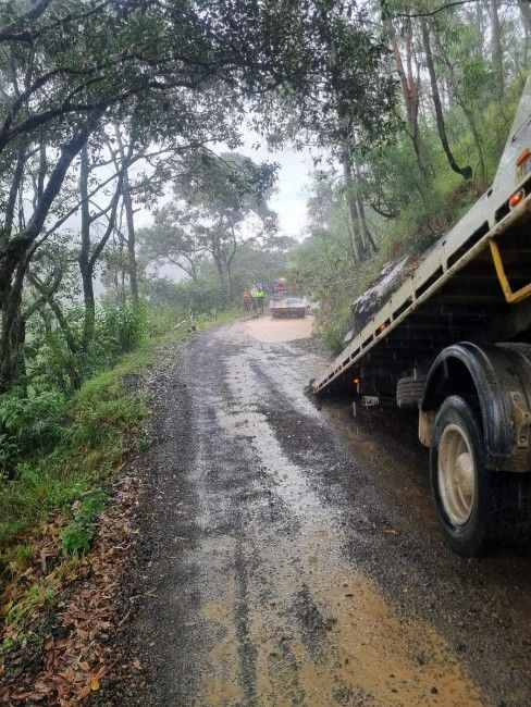 A Tow Truck is Parked on the Side of a Dirt Road — TNT Towing - Coffs Clarence in Evans Head, NSW