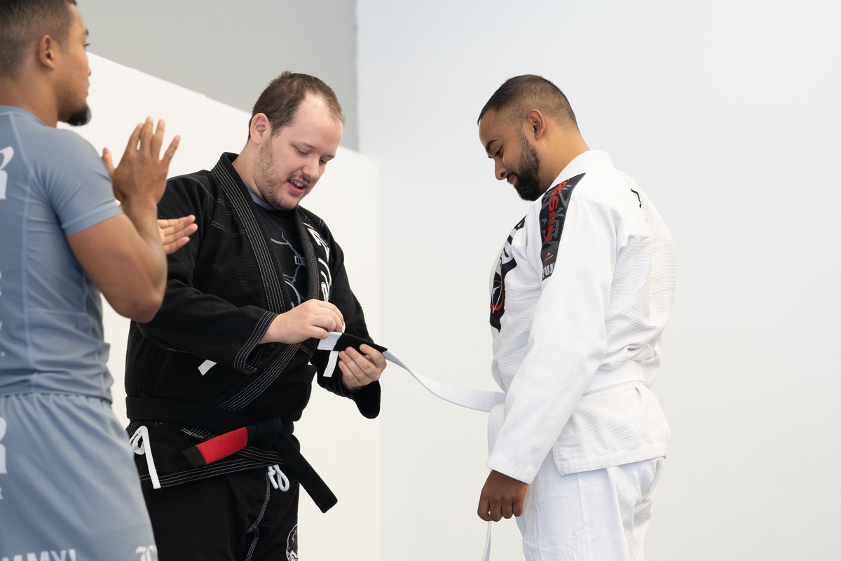 Adults drilling beginner jiu-jitsu fundamentals at All in Jiu-Jitsu in Green Brook, NJ.