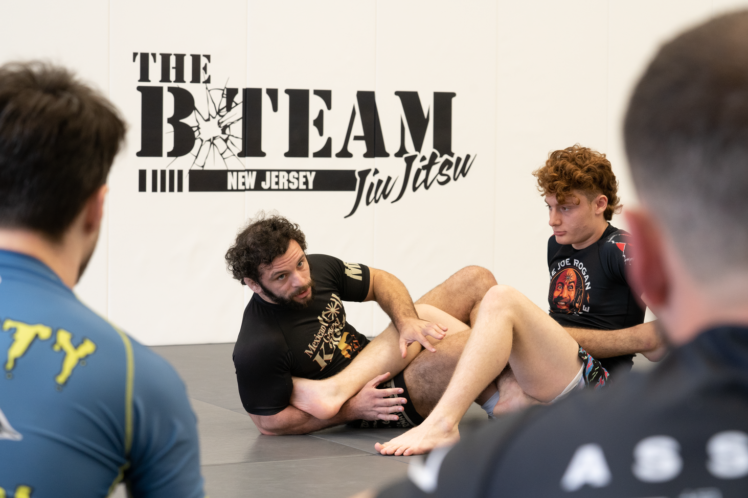Adults practicing Brazilian Jiu Jitsu drills at All in Jiu-Jitsu in Green Brook, NJ.