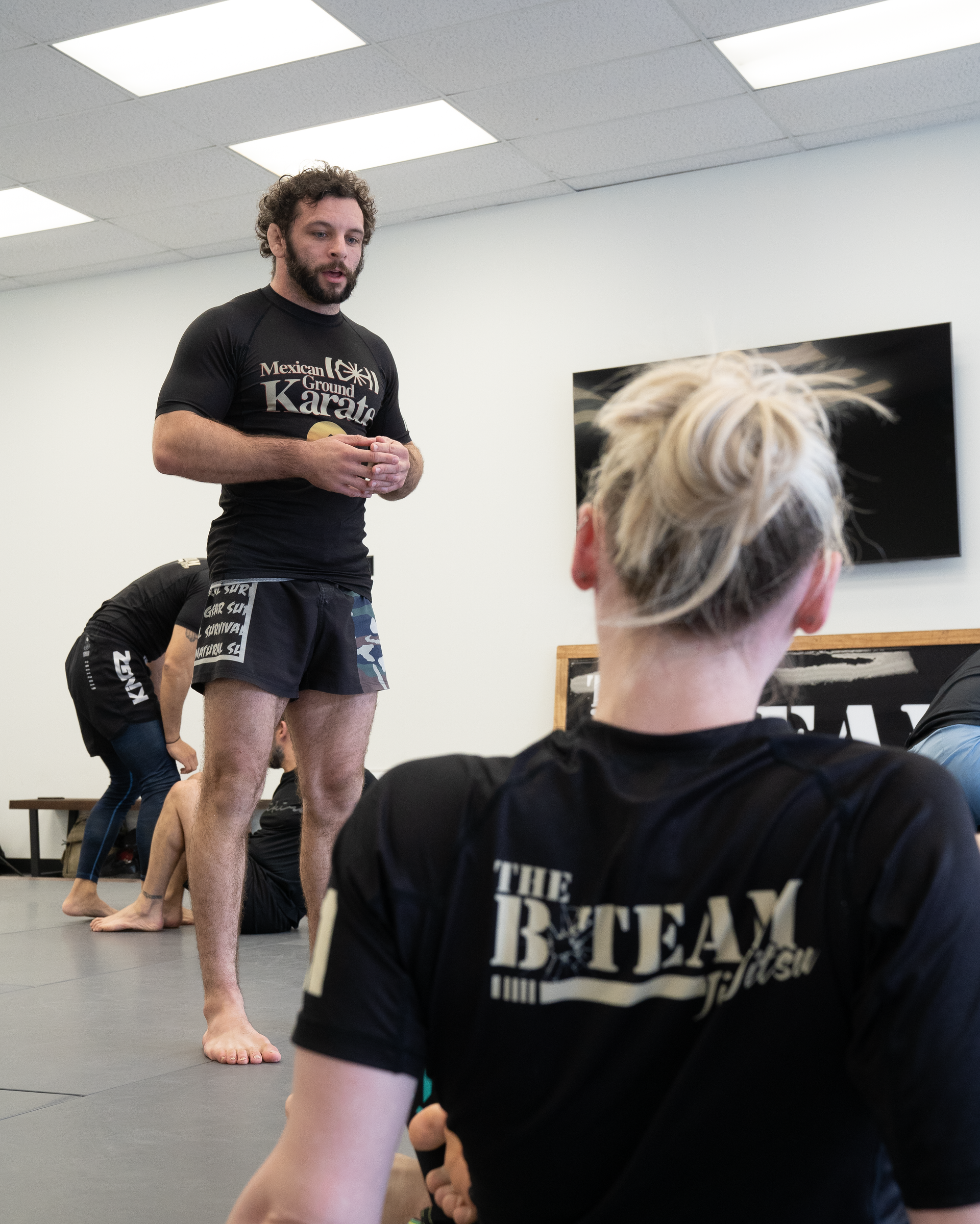 Adults practicing Brazilian Jiu-Jitsu drills at All in Jiu-Jitsu in Green Brook, NJ for strength and stress relief