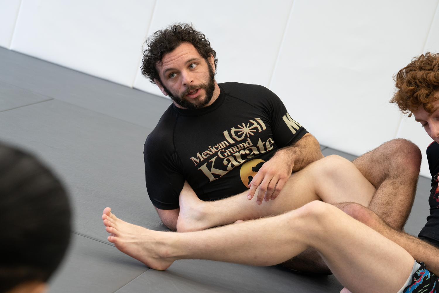 Adult students practice partner drilling at All in Jiu-Jitsu in Green Brook, NJ, building fitness.