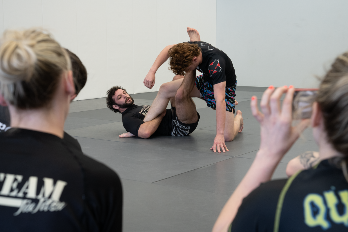 Adults drilling jiu-jitsu techniques at All in Jiu-Jitsu in Green Brook, NJ to build strength and focus.
