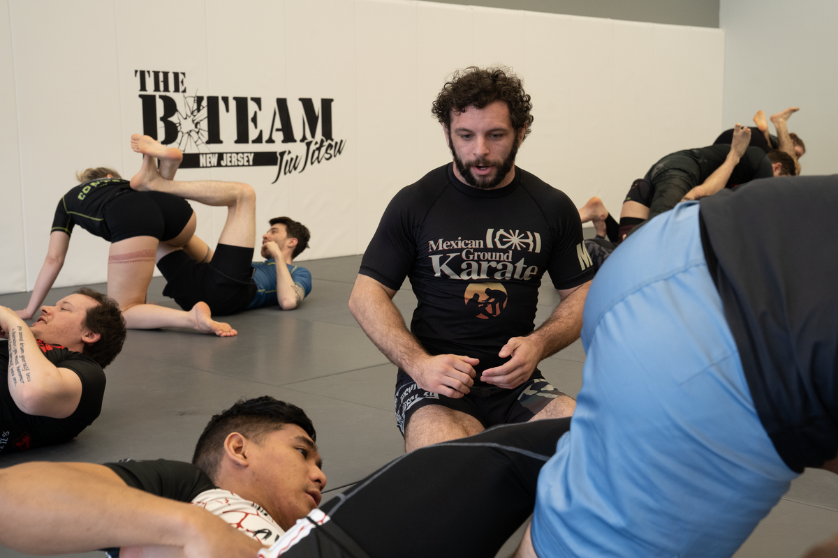 Adults drilling Brazilian Jiu-Jitsu techniques at All in Jiu-Jitsu in Green Brook, NJ for fitness and stress relief.