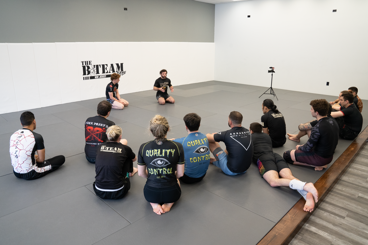 Beginners drilling guard and escape basics at All in Jiu-Jitsu in Green Brook, NJ for safer confidence.