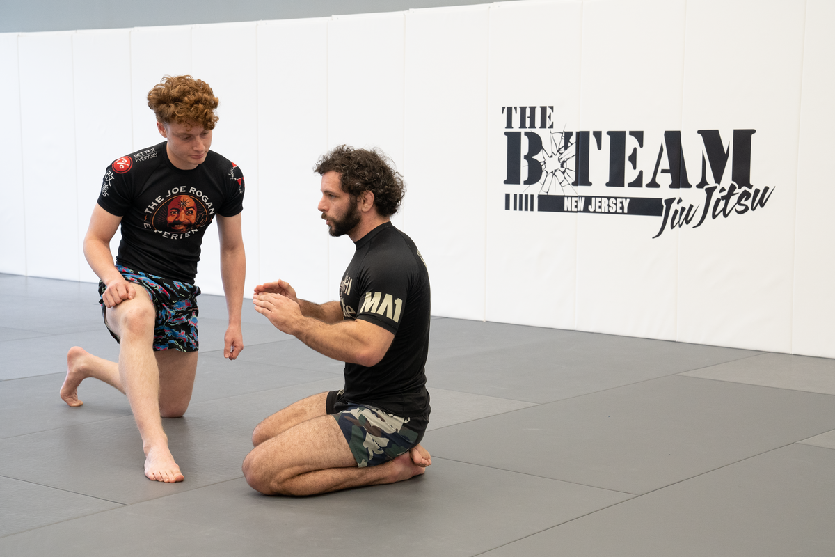 Adults drilling Jiu Jitsu techniques at All in Jiu-Jitsu in Green Brook, NJ for focused stress relief