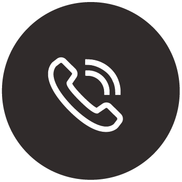 A phone icon in a black circle on a white background.