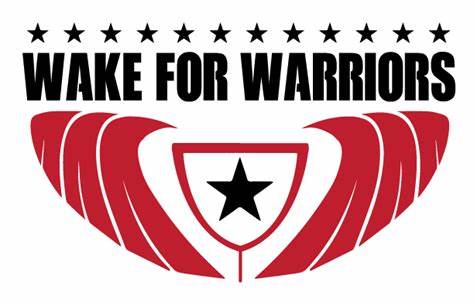 A logo for wake for warriors with wings and a star.
