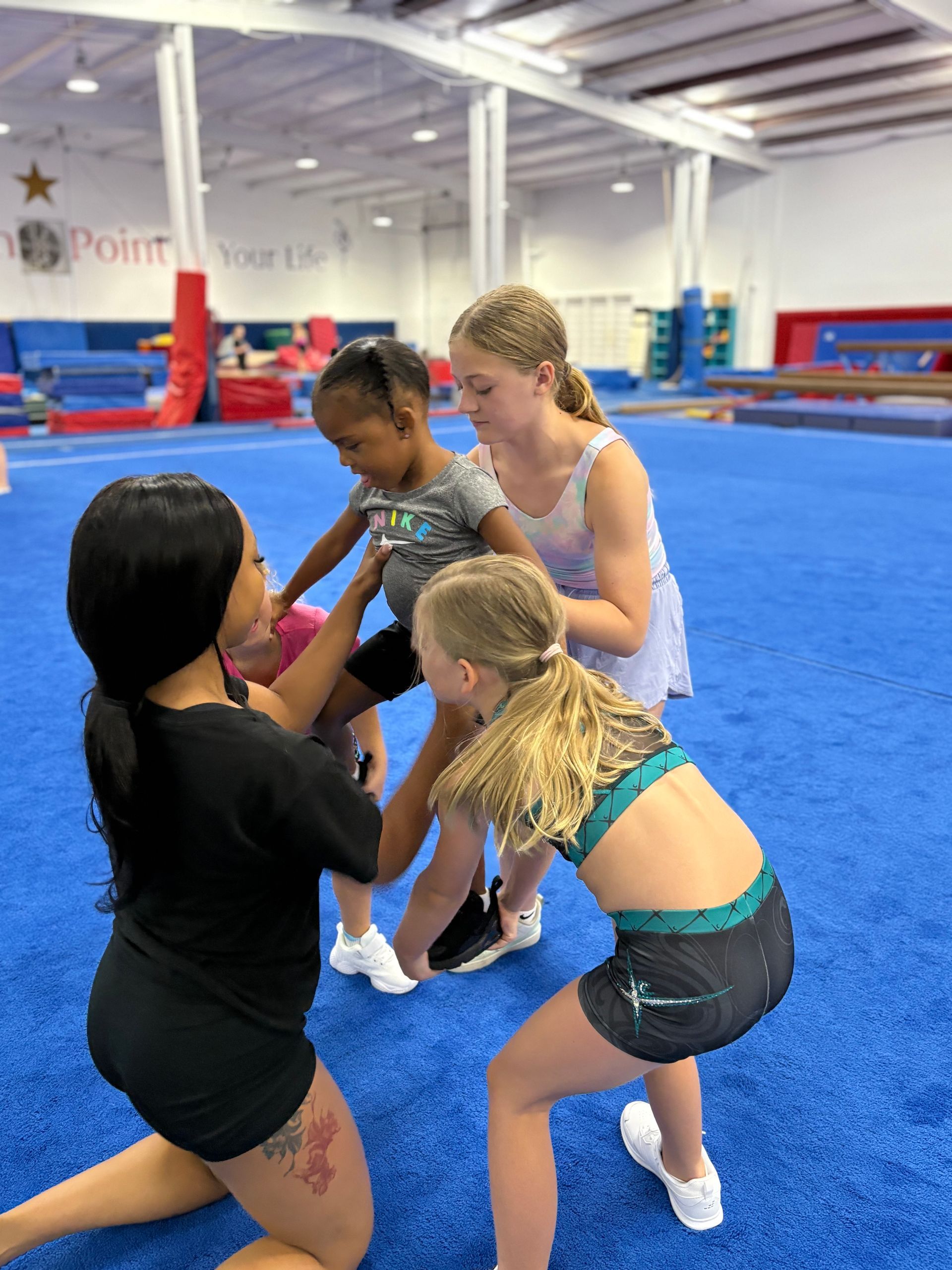 High Point Cheer Stars athletes practicing a stunt