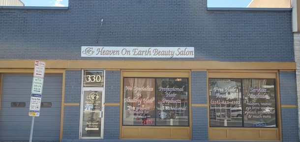 Front of a blue storefront with a sign reading “Masonic Dr. Light’s Psychic S...” and large display windows