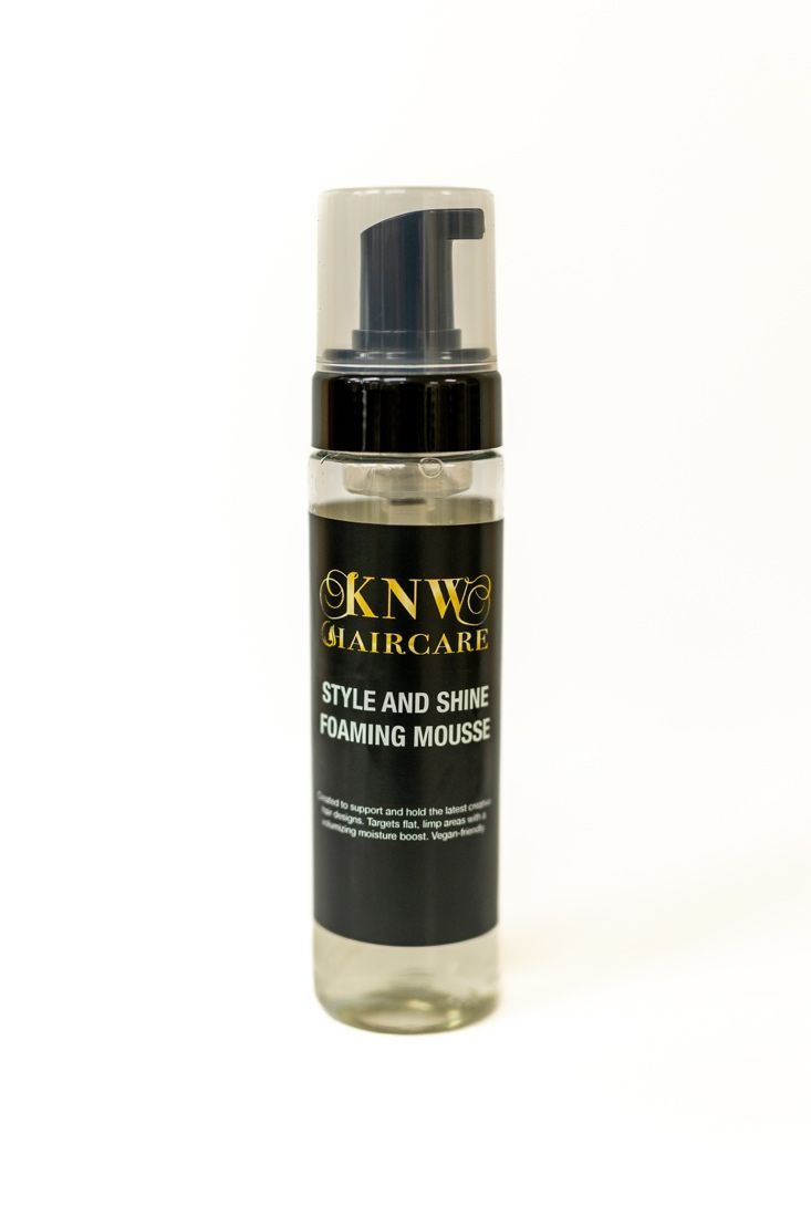 Black KNWs Haircare foaming mousse bottle on a white background