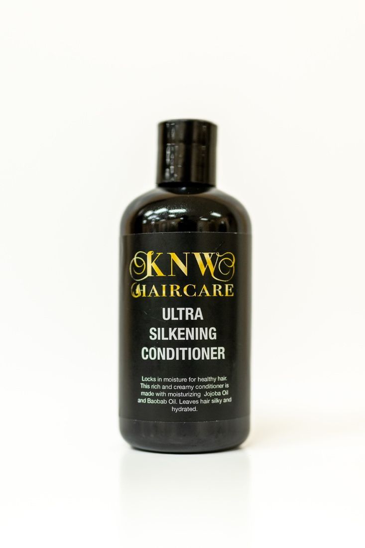 Black bottle of KINWA Haircare Ultra Silkening Conditioner on a white background