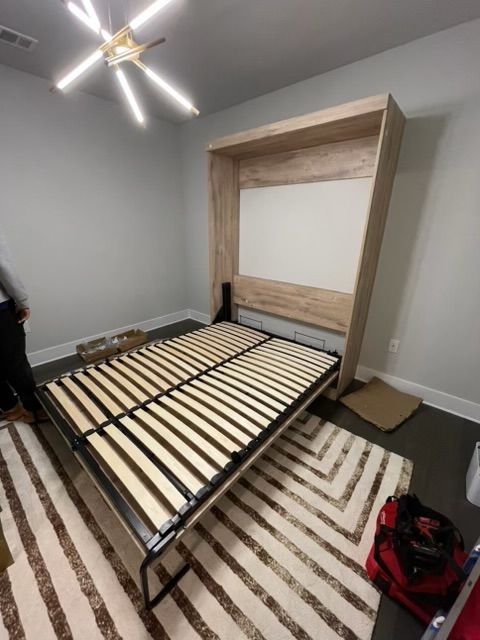 man assembling new furniture