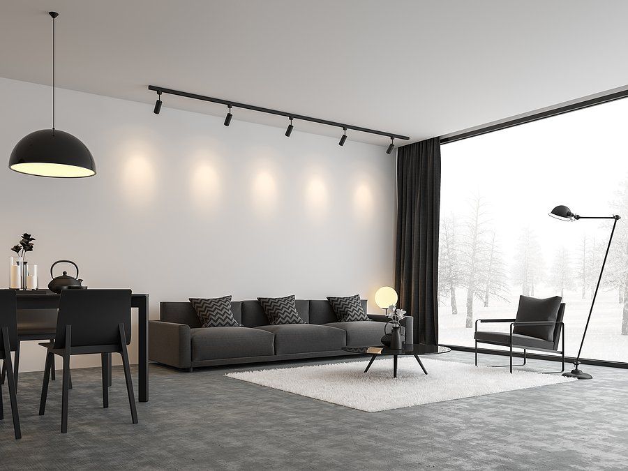 a living room with black couch