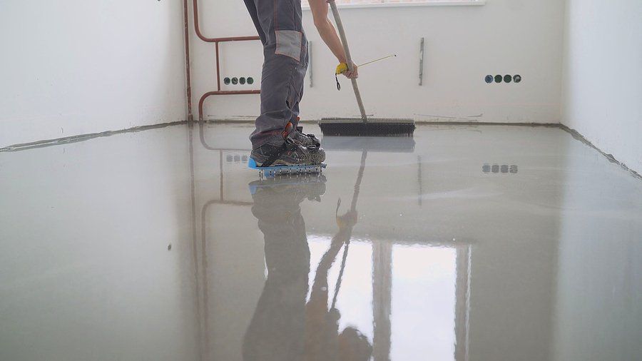someone putting epoxy coating on the floor