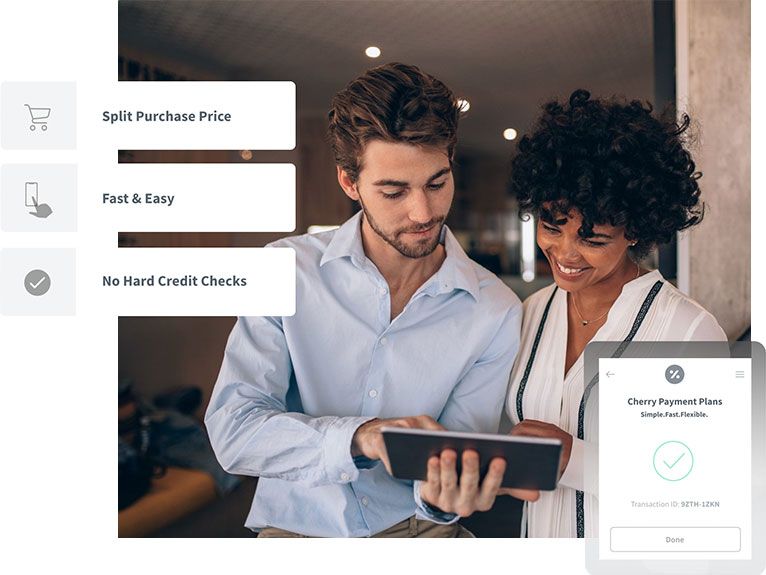 A man and a woman are looking at a tablet together.
