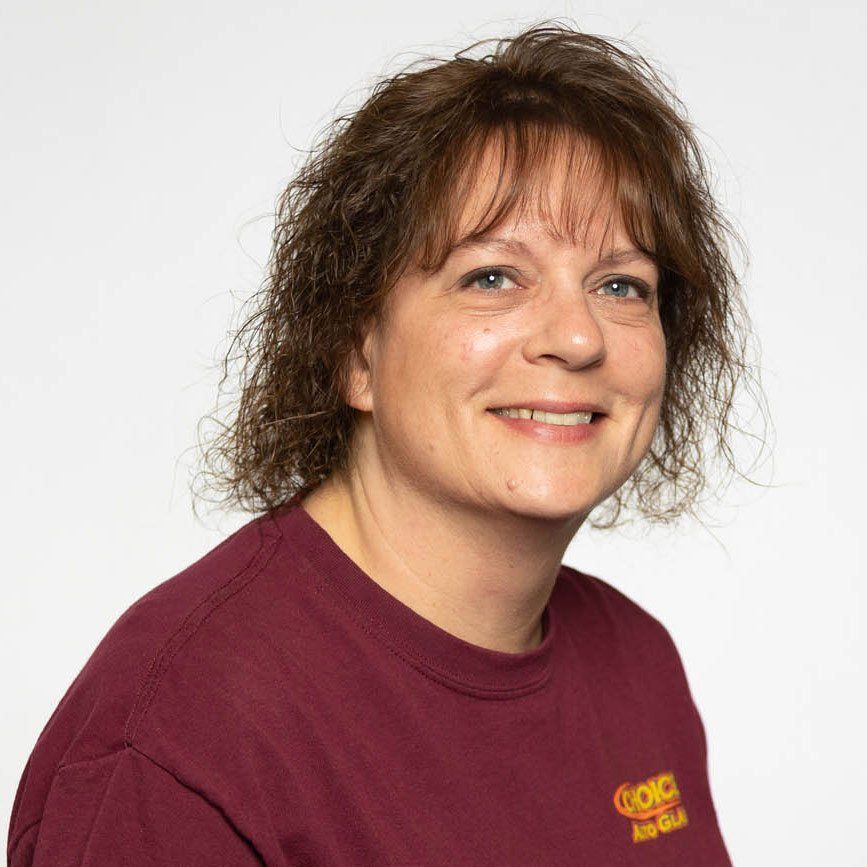 A woman wearing a maroon t-shirt