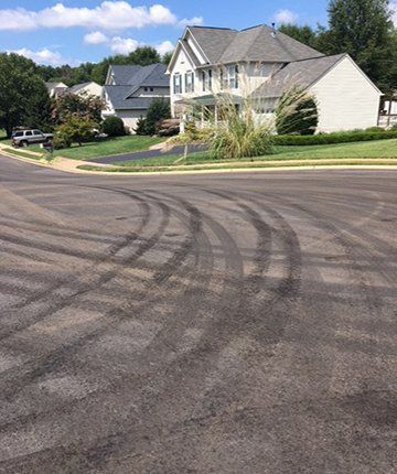discoloration and tire marks in slurry surface before wear in