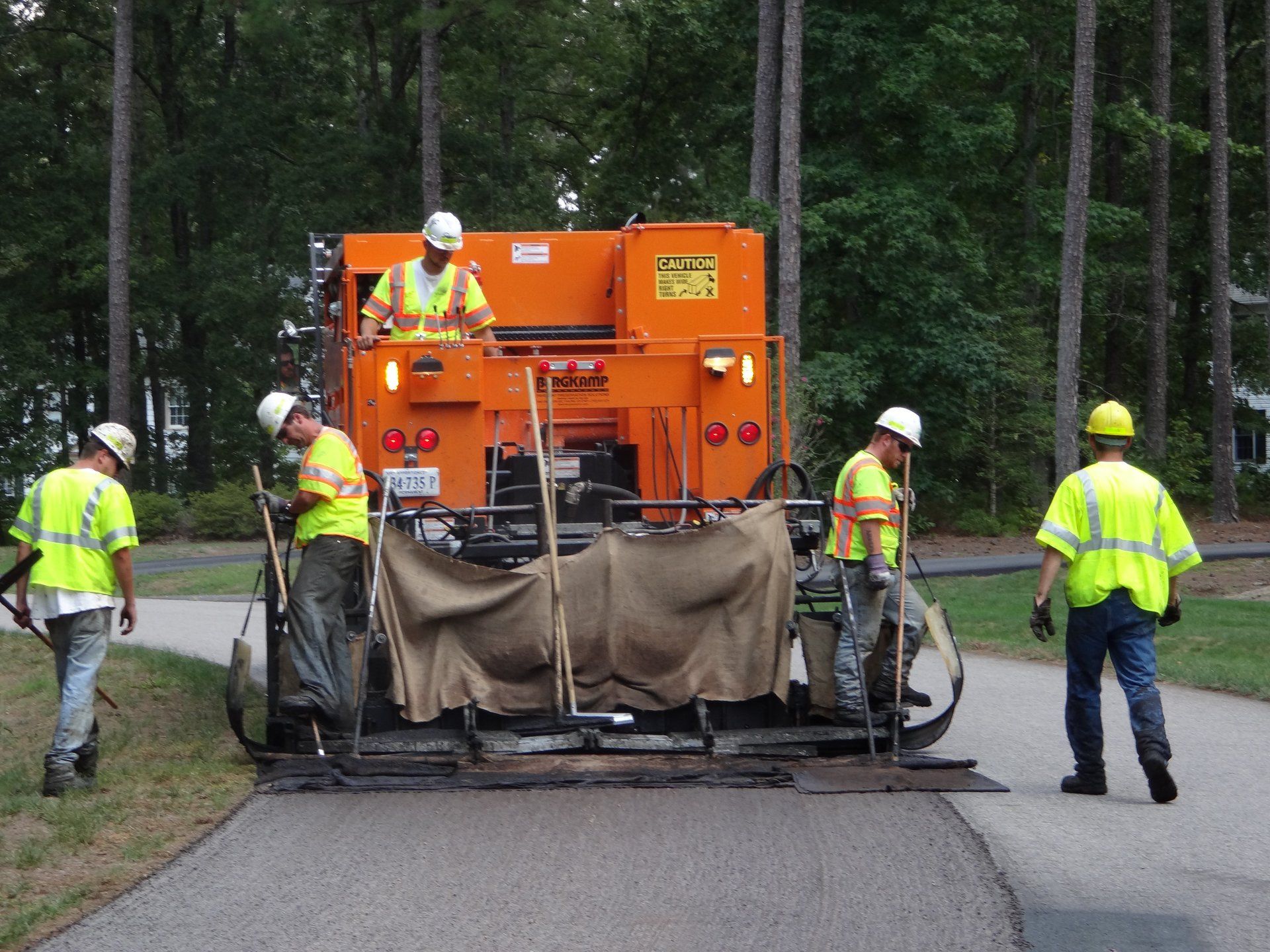 a slurry seal crew at work