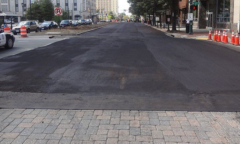 UCI bike race start/finish paved with slurry surface