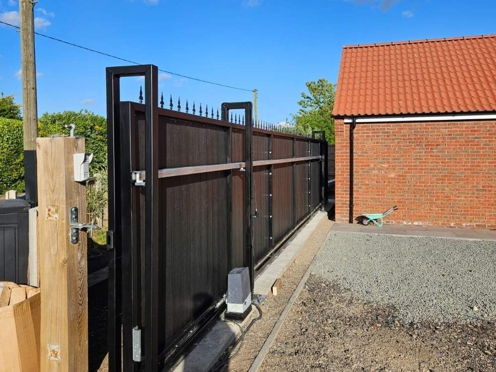 Steel electric gate frame being installed on site before infill panels are fitted