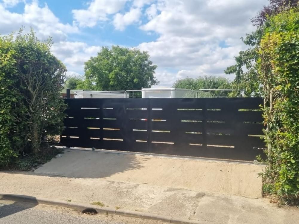 Contemporary horizontal slat electric gates on a residential driveway