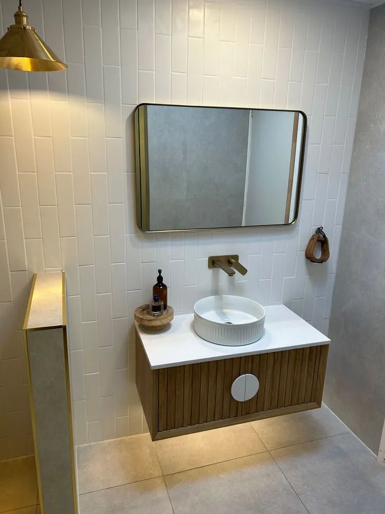 Modern Bathroom Vanity With Round Sink, Mirror, and White Tiled Walls — The Plumbing & Drainage Co. in Mittagong, NSW