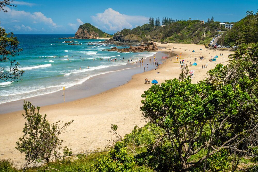 A Beach With a Lot of People on It and Trees in the Foreground — Stitch 2340 In Port Macquarie, NSW A Beach With a Lot of People on It and Trees in the Foreground — Stitch 2340 In Port Macquarie, NSW